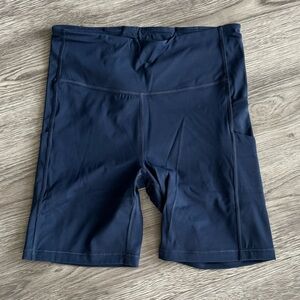 BARELY WORN Athleta Ultimate Stash Pocket 7”Short in Navy